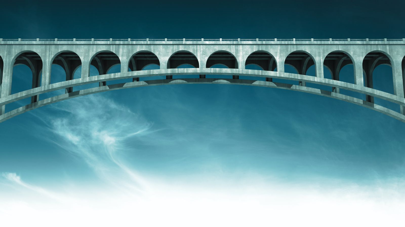 Das Bild zeigt eine weit gespannte Brücke vor blauem Himmel.